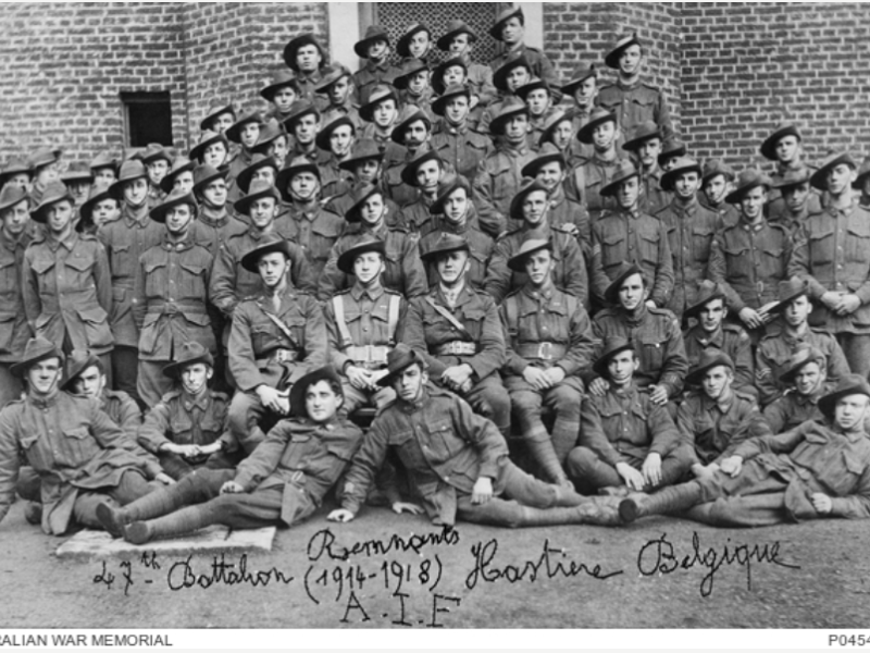 Group portrait of 73 men of the 47th Battalion at Hastiere, December 1918