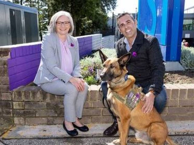 Cronulla RSL's chief executive Sue McNeil, Sutherland Shire mayor Carmelo Pesce and retired war dog Manic at the official opening of the memorial garden. Picture supplied
