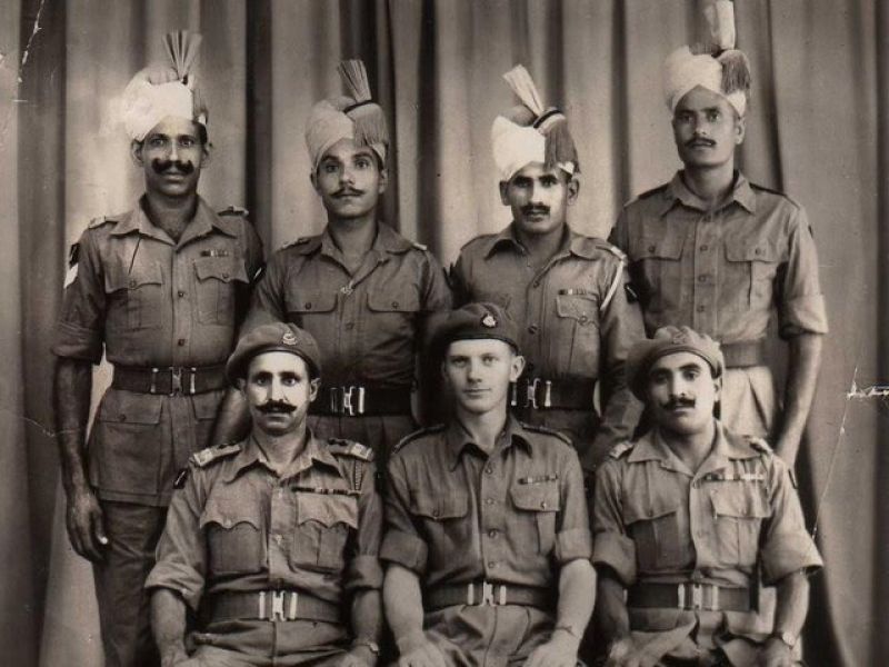 A regimental group photo of British-Indian Commandos who fought off a Japanese attack in Assam, India, WW2