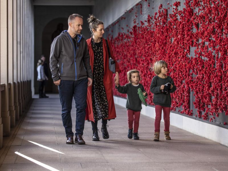 Visitors looking at the roll of honour