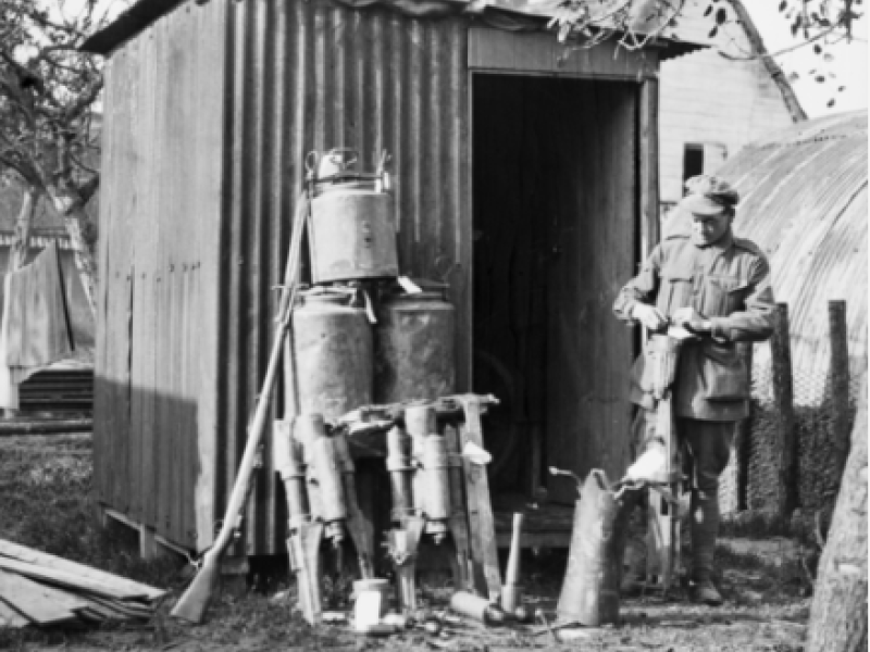 Corporal Ernest Lionel Bailey, 51st Battalion and later Australian Corps Salvage AIF, tagging battlefield trophies for the Australian War Museum at the Hoograaf Collecting Depot, 1917