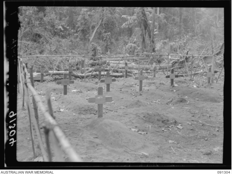 Bougainville. 1945-04-27. Temporary war cemetery, Toko. Battle casualties from the action in south Bougainville which will later be interred in the Torokina cemetery