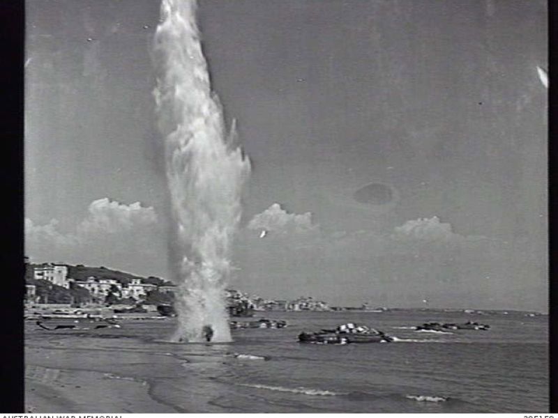 German shells bombarding amphibious trucks at the Anzio beachhead.