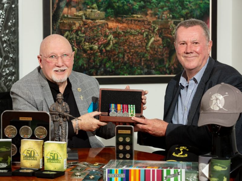 Vietnam Veteran Wayne Lyons with 50th anniversary commemorative medallion designer Steve Rainey at the Military Shop in Fyshwick. Photo: Michelle Kroll.