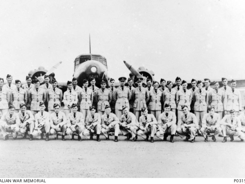 Edmonton, Canada. July 1941. Group portrait of members of A FLight, Empire Air Training Scheme, standing in front of an Avro Anson aircraft (6048)
