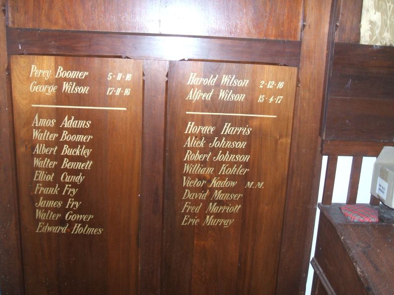 Honour Roll 1 - consists of two stained wooden panels on a Vestry Stand