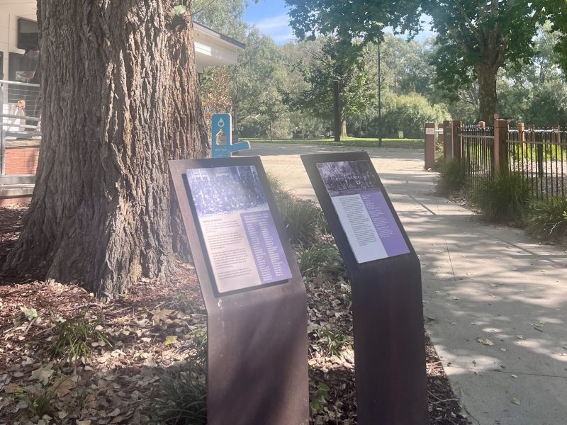 The two information panels within the park, with the Murray River in the background