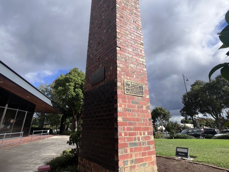 The belltower stands next to the church
