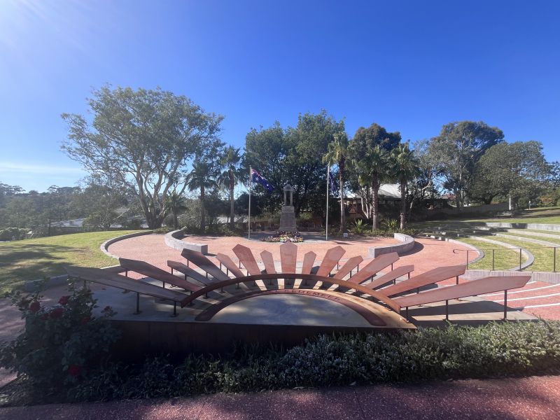Rising sun sculpture facing war memorial and amphitheatre to the right
