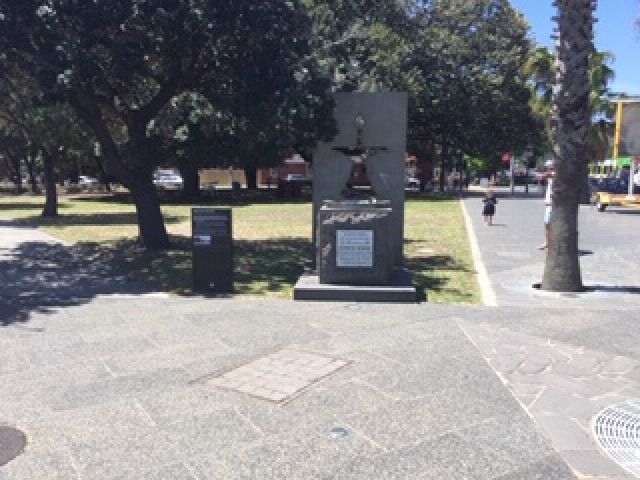 The drinking fountain has a plaque on the front and an information diplay on the left side