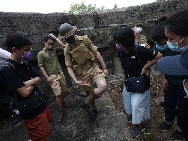 Hong Kong war history buff Franco Yeung wears a replica uniform of Hong Kong volunteer soldiers as he leads a tour of the Mount Davis Battery. Photo: Jonathan Wong