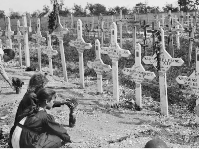 French children tending graves of Australians killed at Villers-Bretonneux's Adelaide Cemetery, 1919