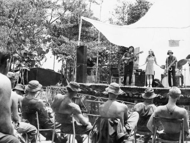 ‘Little Pattie’ on-stage performing for troops in Vietnam, 1966. Photo: Australian War Memorial.