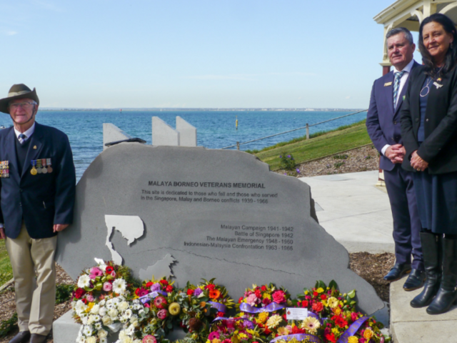 Cr Jim Mason and Christine Couzens MP with veterans beside the newly restored memorial. Photos: SUPPLIED