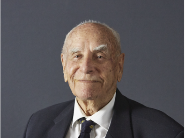 Studio portrait of S5337 Able Seaman Ronald Ernest Smith, served in the Second World War on HMAS Canberra, RAN Station No. 4, HMAS Nizam and HMAS Rushcutter, RAN, 2016