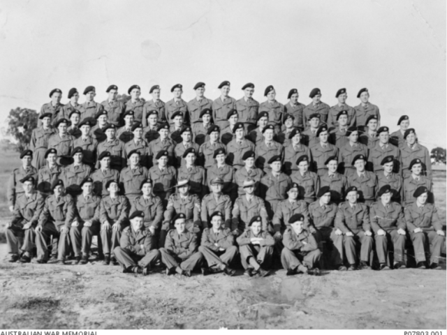 Group portrait of 14 National Service Training Battalion. In the second row from front, centre, are three officers of the Royal Australian Artillery, inc Second Lt Peter John Badcoe, c.1955