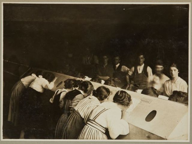 Male and female staff using an 'inhalatorium' at the Kodak Australasia Pty Ltd factory in Abbotsford.