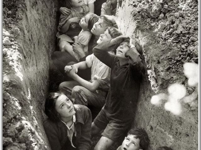 School children in slit trench