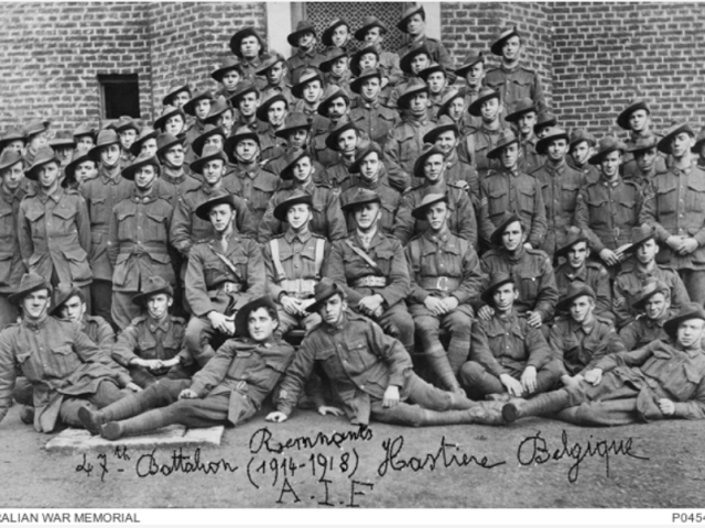 Group portrait of 73 men of the 47th Battalion at Hastiere, December 1918