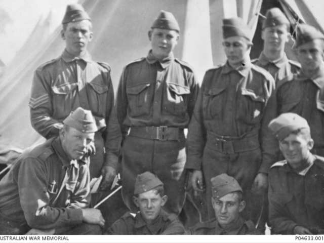 Informal portrait of nine members of the 10th Battalion, c.1914. Bottom right is Pte Malcolm St Aiden Teesdale Smith