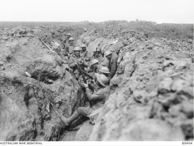 Australians in the second line of the trenches before Riencourt (near Bullecourt), in May 1917, cleaning their rifles in readiness for an attack.