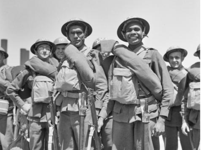 Informal portrait of two Aboriginal servicemen and best mates Private George Leonard (NX43504) and Private Harold West, (NX43500), 14th Reinforcements to the 2/1st Battalion