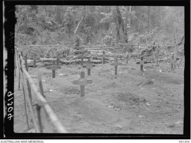 Bougainville. 1945-04-27. Temporary war cemetery, Toko. Battle casualties from the action in south Bougainville which will later be interred in the Torokina cemetery