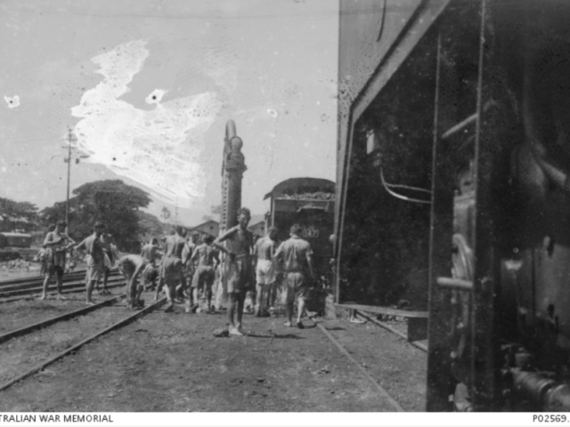 Members of 'F Force', an enforced Allied prisoner of war (POW) working party sent to construct the Burma-Thailand railway, at a watering point near the border to Thailand. 1943.