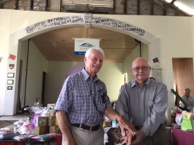 Graham Coleman and Herb Oliver, cutting the anniversary cake in the Hall on the 10th November 2018 , the 100th anniversary of the opening of the Booyal Memorial Hall, which was officially opened on the 10th November 1918