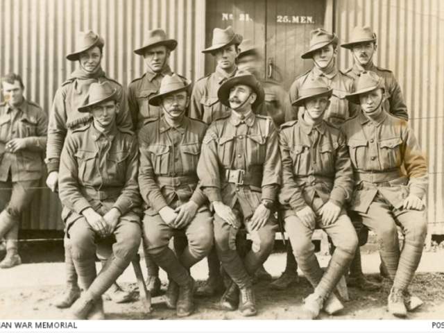 Studio portrait of members of the 33rd Battalion. Front row, far left, is Pte Daniel George Orman; the others are unidentified, 1917.