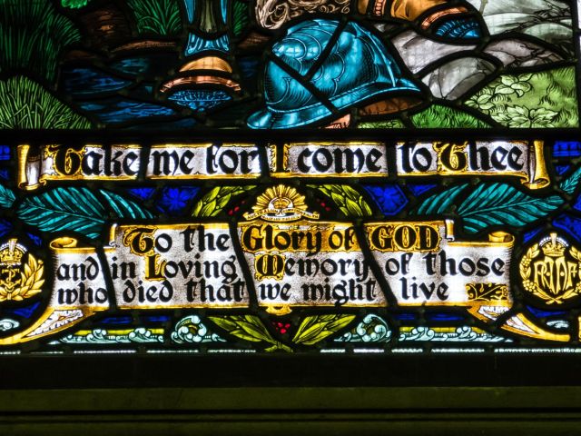 Words and insignia at the base of the window