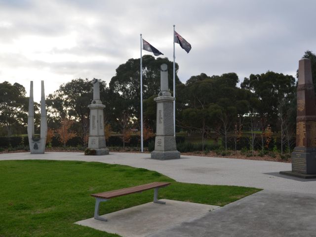 Two WWI columns flanked by WWII memorial and Boer War memorial