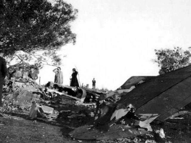 Canberra residents examine the wreckage of A16-97