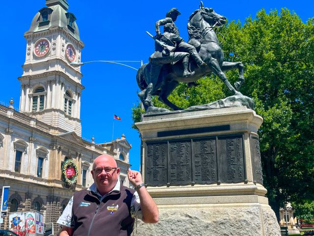 Mayor Cr Des Hudson standing in front of the Boer War Memorial Statue in Sturt Street.
