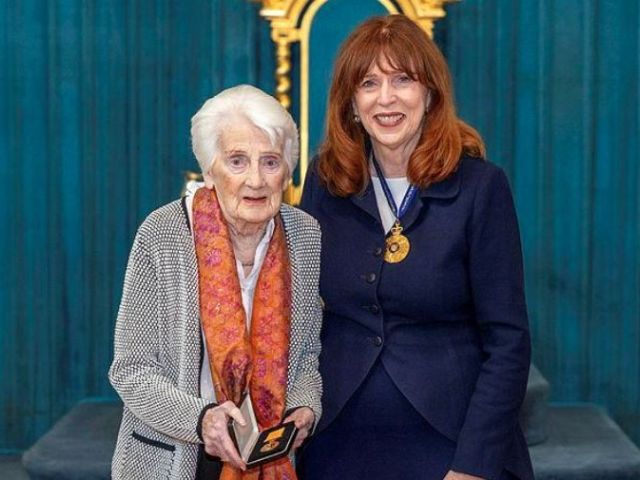 Victorian Governor Professor Margaret Gardner AC (right) presents Margaret Ekberg, the daughter of Pilot Officer David Taylor, with his Medal for Gallantry for heroism in PNG during the Second World War.