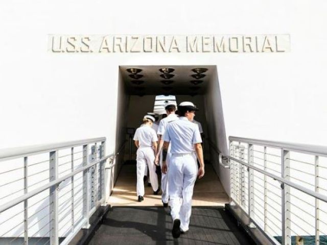 HMAS Sydney personnel walk on board the USS Arizona memorial at Pearl Harbor, Hawaii, during Exercise RIMPAC. Photos: Leading Seaman Daniel Goodman