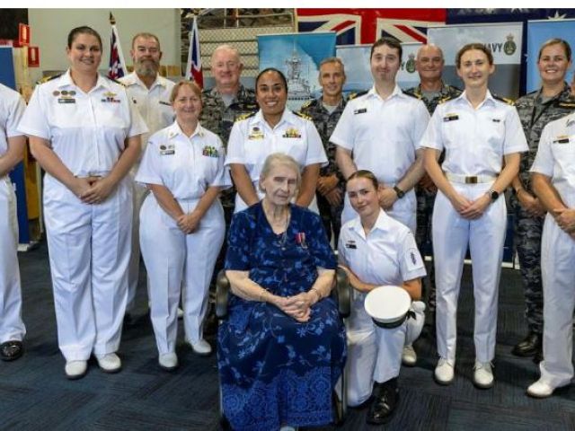 HMAS Moreton Headquarters personnel with Murielle Ahern for her 100th birthday celebration