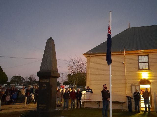 flag being raised at Toongabbie Dawn Service