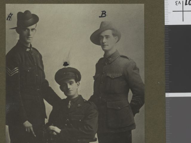 Studio portrait of three brothers taken whilst in England. identified left to right: 168 Temporary Sergeant Leslie Francis Bottom, 1st Battalion; 2nd Lieutenant William Spencer, 15th Battalion (later promoted lieutenant); 1344 Bombardier Joseph Charles Bottom, 14th Field Artillery Brigade 