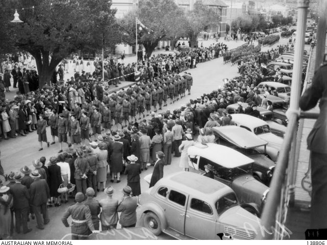 Members of the Australian Women's Army Service (AWAS) and the Australian Army Medical Women's Service march through Albury, NSW, 4 April 1943. Photograph by the Herald Newspaper, 138806.