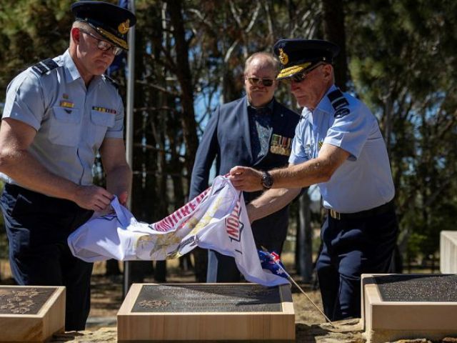 Royal Australian Air Force officers Air Commodore Adam Spinks, left, and Air Commodore Bill Hayden unveil the Australian Armourers Association plaque at the RAAF Memorial Grove, Canberra. Story and photos by Corporal Michael Rogers.