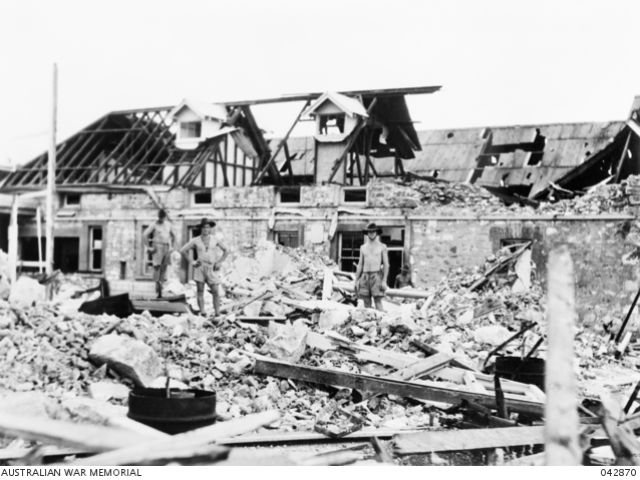 Darwin, NT. February 1942. Australian troops inspect bomb damage caused by Japanese air raids.