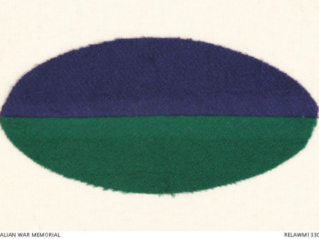 Horizontally aligned oval shaped colour patch for 34 Infantry Battalion AIF, divided purple over green.