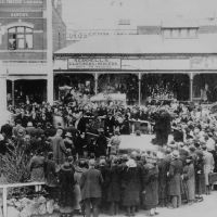 View of unveiling ceremony looking south across Whitehorse Road with Station Street just out of frame to the right, 19 February 1922.