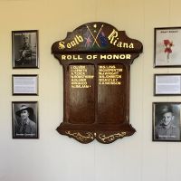 World War One Honour Board with photos and story on either side of it of the four men from South Riana who made the ultimate sacrifice in World War One and World War Two.