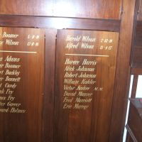 Honour Roll 1 - consists of two stained wooden panels on a Vestry Stand