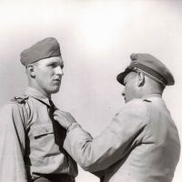 Wings Parade- Lt Col B J Feideldit decorating Sergeant Borgan Brouwer  with Cross of Merit 3AOS Port Pirie 10 November 944