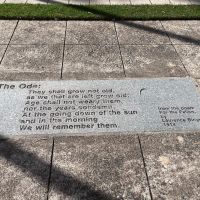 The Ode is embedded in the parade ground, facing the panels and the two statues