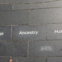 The tile listing the guiding principles of Courage, Ancestry and Mateship.