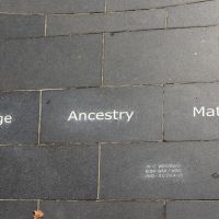 The tile listing the guiding principles of Courage, Ancestry and Mateship.
